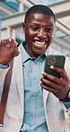 Fist pump, excited and black man with phone in glass office with win, profit or approval on investment. Happy, cellphone and financial manager with celebration for finance achievement in workplace.
