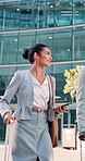 Talking, city and business people with suitcase and walking for commute, travel and work trip. Corporate, team and woman with man in town for convention, meeting and discussion for journey together