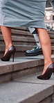 Stairs, walking and legs of business people in city for commute, travel and trip to workplace. Corporate, team and feet of woman with man on steps for journey, career opportunity and partnership