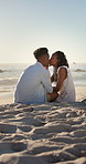 Smile, kiss and couple with love on beach, romantic moment and connection for anniversary holiday. Support, affection and black people with island vacation for bonding by sea, space and relax in Bali