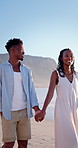 Smile, travel and holding hands at beach with couple, adventure and affection on summer holiday. Happy, black people and walking at sea for romantic date, morning journey and bonding on vacation trip