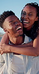 Laugh, walk and black couple with piggyback on beach for honeymoon trip, conversation or bonding. Support, happy people and carry at seaside for romantic stroll, anniversary vacation and funny chat