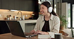 Woman, laptop and video call with smile for remote work from home, headphones and discussion on web. Person, laugh and virtual assistant with computer, review and happy with feedback at apartment