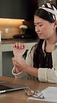 Home, wrist pain or Asian woman with laptop for remote work, joint tension or massage ache for relief. Typing, creative project or freelancer with sprain for discomfort, carpal tunnel syndrome or pc
