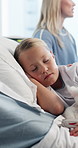 Relax, sleeping and child on bed in hospital with teddy bear for comfort on operation, surgery or recovery. Rest, medical checkup and girl patient with plush toy in ward for rehabilitation in clinic.