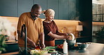 Help, cooking and interracial couple in home with support, love and meal prep with healthy food in kitchen. Mature, man and woman with ingredients for recipe, smile and culinary skills for nutrition