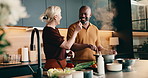 Taste, cooking and interracial couple in home with support, love and meal prep with healthy food in kitchen. Mature, man and woman at stove with recipe, help and nutrition for diet or culinary skills