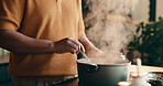 Pot, cooking and hands of man in kitchen at house for meal, dinner or supper with healthy diet. Steam, stir and male person with preparing dish for wellness, nutrition or recipe in apartment.