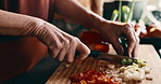 Hands, vegetables and woman in kitchen at house for nutrition, health and cooking meal for diet. Knife, spring onion and female person cutting ingredients for dinner, dish or supper in apartment.
