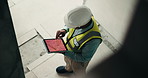 Architect, inspection and man with tablet screen for building safety above on construction site. Top view, male person or civil engineer checking security with technology for architecture development