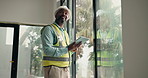 Tablet, electrician or black man with inspection for maintenance, building safety or security. Male person, technician or checking property system with technology for power or electrical installation