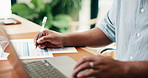 Man, hands and writing with laptop in office for finance, budget planning or tax deduction. Male person, accounting or checklist with paperwork, documents or computer for financial audit in workplace