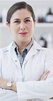 Scientist, face and woman with arms crossed, innovation and confident for pharmaceutical development. Happy, medical professional and person with pride, science and healthcare breakthrough in clinic