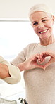 Face, love and mature women with heart hands, support and trust with happy friends at home together. Group, portrait and symbol of affection, care and smile with community of people for kindness