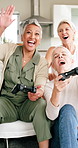 Mature, friends and playing video games together in home living room with high five, win and fun. Women, console and group laugh with applause, celebration and victory of winner or player in house