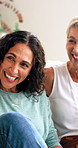 Bonding, laugh or friends on sofa with chat, funny conversation or happy moment in reunion. Smile, gossip or mature women in home with hangout, joke reaction or connection in healthy relationship.