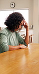Anxiety, stress and woman with depression in dining room of home for mistake or regret. Grief, loss and pain with mature person at table in apartment for nostalgia, reflection or sad memories