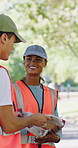 Volunteer, team and talk in park with gloves, sustainability or instructions for NGO cleaning project. People, discussion and charity leader outdoor with clipboard, PPE or environmental conservation.