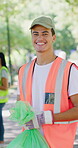 Volunteer, man or face with plastic bag at park for environment cleanup, earth day or recycling. Sustainable NGO, person and happy in nature for waste management, green project or community service