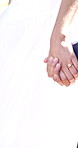 Outdoor, couple and holding hands at wedding with love, trust and commitment promise at event. Nature, people and walking with support for relationship development, loyalty and unity in matrimony
