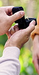 Couple, hands and ring box for proposal, love and engagement together with partner at park. Marriage question, man and woman with jewelry for connection, relationship commitment or romantic surprise