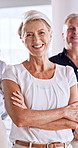 Face, business people or manager with arms crossed in office, talent management or human resources. Portrait, confidence and mature woman with team for recruitment career, smile or employee relations