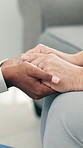 Woman, nurse and holding hands with elderly patient for empathy, healthcare or understanding in home. Female people, caregiver and touch with senior care for comfort, sympathy or trust in house