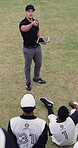 Baseball, coach and tablet screen with people on field together for strategy or tactics. Above, pointing and technology with man at sports venue for discussion or instructions to team of players