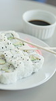 Asian, food and sushi on table with chopsticks, culinary and seafood cuisine at restaurant. Traditional, meal and Japanese catering with soy sauce, fine dining and hospitality for authentic delicacy