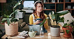 Woman, plants and research with phone in home for indoor gardening, information or online tips. Female person, florist or botanist monitoring growth of ferns with headphones or smartphone for botany