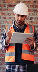 Architect, worried and man with tablet in building, research or plan for architecture design on web. Civil engineer, anxiety and person with tech for property development, confused and typing info