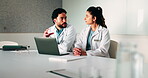 Laptop, meeting and talking with doctors in office for planning, surgery schedule and research. Medical, discussion and advice with people in hospital for treatment feedback and diagnosis report