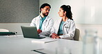 Laptop, meeting and planning with doctors in office for talking, surgery schedule and research. Medical, discussion and advice with people in hospital for treatment feedback and diagnosis report