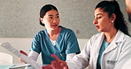 Doctor, nurse and meeting in hospital with clipboard, review health insurance report and discussion. Healthcare worker, people and talk in clinic with medical aid policy, collaboration and planning.