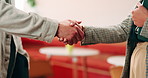 People, interview and handshake with business in cafe for recruiting deal or onboarding agreement. Recruiter, candidate or shaking hands with discussion in restaurant for hiring, teamwork or meeting