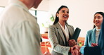Woman, handshake and team with applause at office, success or motivation for goal at finance company. Business people, shaking hands and celebration for deal, achievement or congratulations at agency