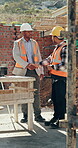 Construction, men and talk with handshake on site for inspection pass, safety code or agreement. Smile, building inspector and shaking hands with foreman outdoor for compliance, project trust or team