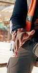Construction, hands and worker with wrist pain on site for physical strain, arthritis or work accident. Cramp, massage and man with muscle fatigue outdoor from manual labor, injury on duty or tension