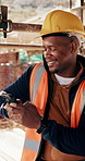 Engineer, man and smile at construction site with phone, scaffolding or check social media on break. Black person, outdoor and typing with tech, text message or building framework for infrastructure.