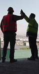 Construction, happy or men on site with high five, team success or motivation in building project. Back, people or engineers with collaboration, encouragement or victory in infrastructure development