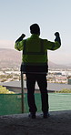 Back, architect and man with celebration at construction site, development achievement and winning. Property progress, project milestone and person with fist pump for building goal, space and victory