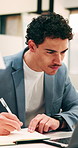 Business, man and notebook with laptop in office for research, notes and schedule for accounting. Person, writing or pc in workplace with finance report, audit reminder and information for investment