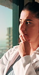 Serious, woman and doctor thinking in hospital with regret, patient loss and vision of medical mistake. Worry, surgeon and female person with stress, healthcare reflection and burnout of surgery fail