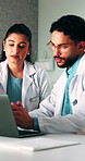Medical, meeting or team in hospital with laptop, research or patient review for treatment plan. Healthcare, people or doctors with tech, collaboration insight or partner feedback in post surgery.
