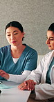 Healthcare, team and women with document in clinic, administration and talking with medical records. Health specialist, collaboration and people with report, discussion and treatment plan in hospital