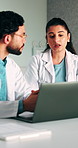 Medical, research or team in hospital with laptop, discussion or patient review for treatment plan. Healthcare, people or doctors with tech, collaboration progress or partner feedback in post surgery