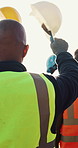Team, man or construction worker wave helmet with celebration for finish project, solidarity or success. Back, flare or people cheer outdoor with hard hat for engineering goals, milestone or victory.