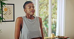 Breathing, yoga and relax with black woman in home for meditation, holistic healing and zen. Spiritual wellness, fitness and peace with person in living room of apartment for balance and mindfulness 