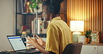 Headset, laptop screen and black woman in home office for help, technical support or remote work. IT assistance, customer care and happy freelancer typing with tech, software advice or talk at night