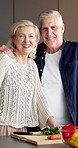 Happy, cooking and face of senior couple in kitchen at house for dinner, meal or food together. Smile, hug and portrait of elderly man with woman for preparing dish with ingredients in apartment.